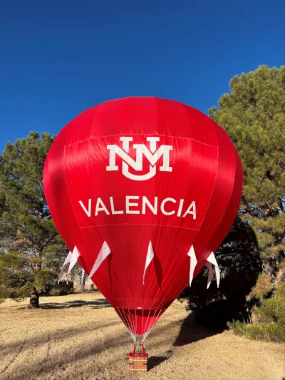 Bright red radio controlled hot air balloon with Valencia logo